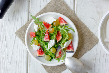 Beautiful vegetarian salad with goat cheese and figs.