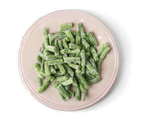 Plate with frozen green beans on white background