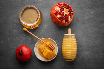 Composition with aromatic honey and fruit on gray table