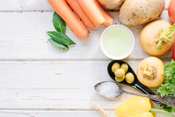 Top view of vegetables, olives and spices.
