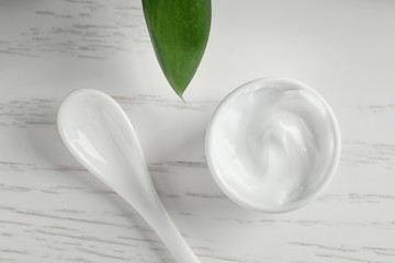 Jar of body cream on table