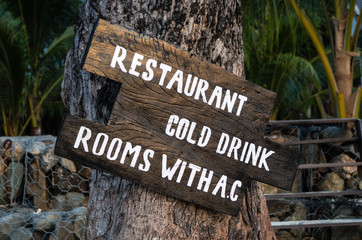 Sign RESTAURANT, COLD DRINK and ROOMS WITH AC.