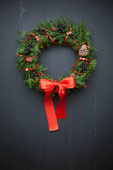Christmas wreath on a wooden background © Mykhailovskyi