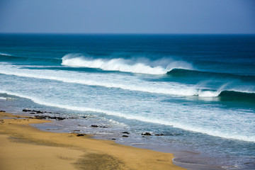 deserted beach with big waves