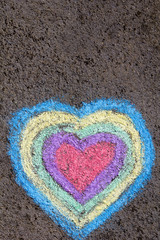 chalk drawing: colorful hearts on asphalt
