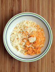 High quality picture of Grated mix of cheddar and Mozzaralla cheeses arranged in a bowl ready to use.
