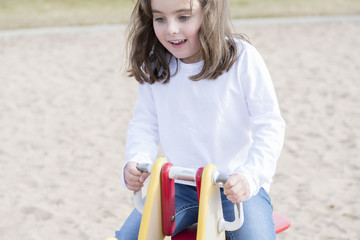 Beautiful 5-year Old Girl Playing Outside in a Playground & Wooded Area on a Fall Day