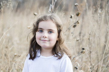 Beautiful 5-year Old Girl Playing Outside in a Playground & Wooded Area on a Fall Day