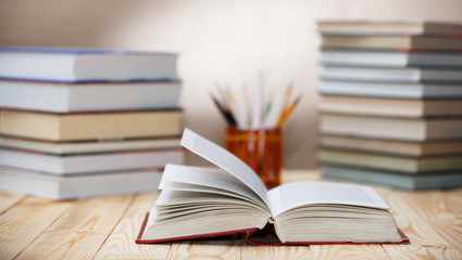 Fototapeta premium Textbooks and books on a wooden table