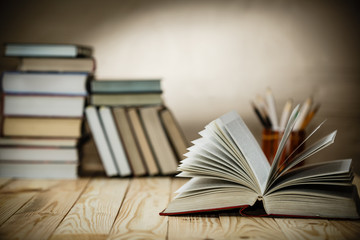 Fototapeta premium Textbooks and books on a wooden table