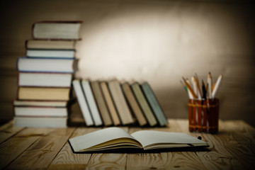 Textbooks and books on a wooden table