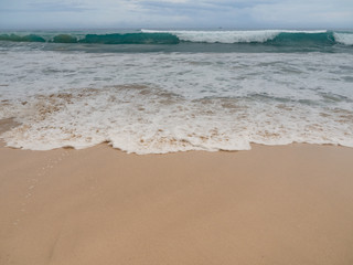 Dreamland beach in Bali. Sand, blue waves. Indonesia, autumn, 2017