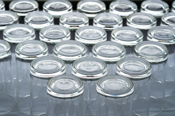 Abstract background of many empty glass of water placed on a table prepared for guests to dining in restaurant.