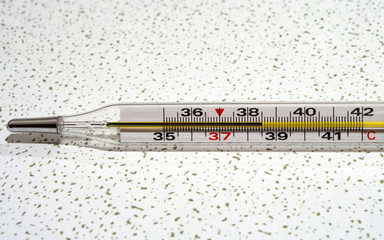 Mercury thermometer which showing 38.5C