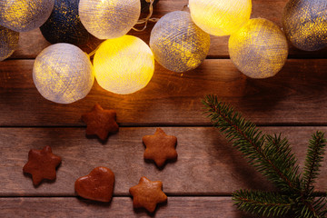 Beautiful lanterns garlands like balls, gingerbread cookies and fir tree  branch