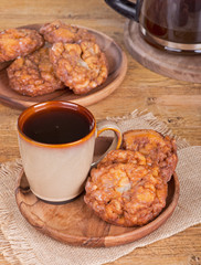 Glazed Apple Fritters and Cup of Coffee