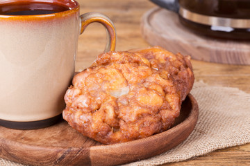 Glazed Apple Fritters and Cup of Coffee