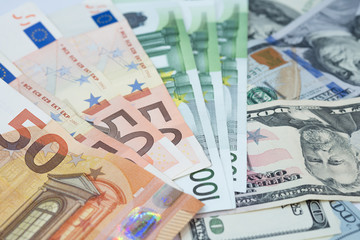Euro and US Dollar money banknotes background.