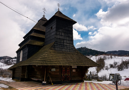 Uzhok, Ukraine - February, 25: Church of the Archangel Michael - UNESCO World Heritage. old wooden building in Carpathian mountains in winter