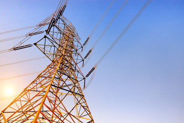 High voltage post or High voltage tower at sunset