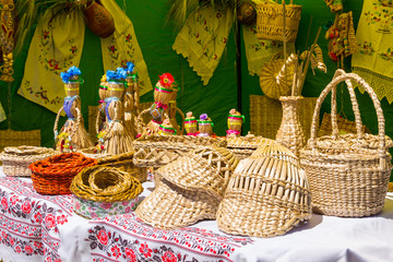 Various handmade wicker products for sale on souvenir market