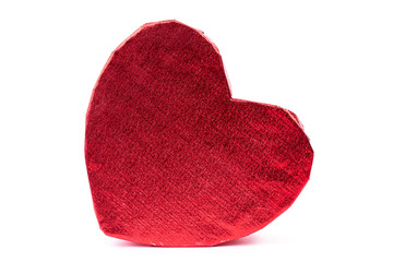 Heart shaped red gift box. Beautiful shiny heart shaped gift box of red color isolated on white background. Holidays and celebrations concept.