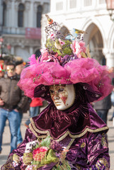 Fototapeta na wymiar Venetian carnival costume decorated with flowers and birds