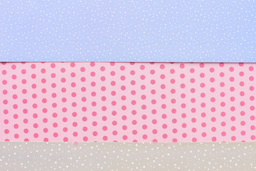 Patterned paper background for handmade craft. Multicolored paper with a pattern of snows for winter handicraft. New Year material for handmade paper ornaments.