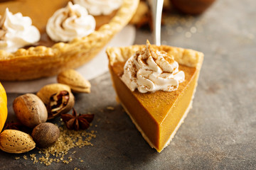 Obraz na płótnie Canvas Pumpkin pie with whipped cream