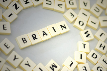 text brain on the gray background near the letters.