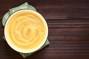 Fresh homemade apple sauce in bowl, photographed overhead with natural light (Selective Focus, Focus on the apple sauce)