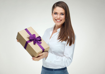 Smiling business woman holding paper gift box.