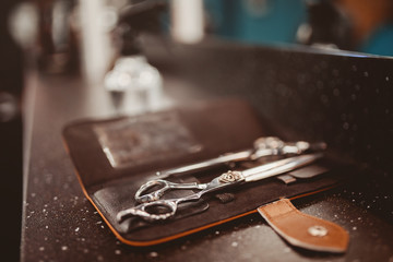 hairdresser's tools: combs, razors, scissors, clip-on hair clipper
