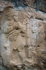 Fototapeta na wymiar Hittite rock relief in south-central Anatolia, Turkey; 8th-century BC king Warpalawas and the storm-god Tarhunzas