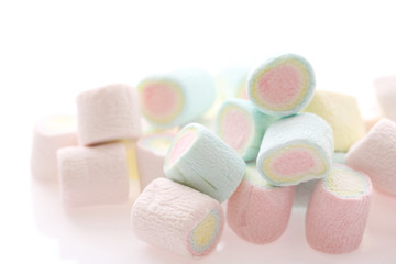 Pastel colourful marshmallows isolated in white background