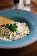 Spaghetti carbonara with ham in white sauce