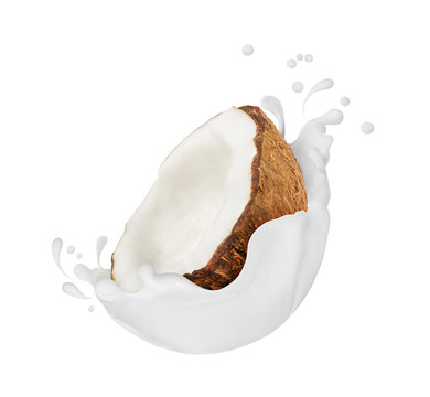 Coconut with milk splashes close-up, isolated on white background