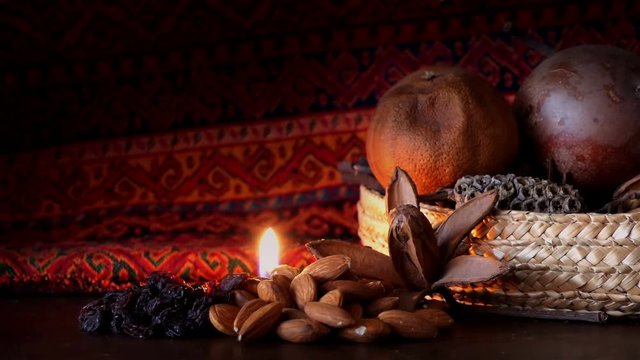 almonds and black raisins. Dry nuts and fruits over beuatiful background with candle light. Gourmet food, healthy and organic food Middle east elements. Ramadan Background. Arabian Nights. Nuts shop