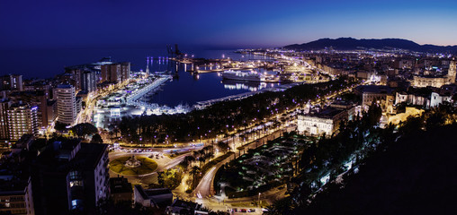 Night view of Malaga harbor from castle, Andalusia in Spain
