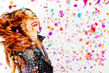 Happy party woman with confetti