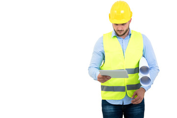 Handsome engineer working with a tablet pc, isolated on white