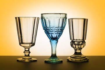 Vintage glasses for alcoholic beverages. Studio photography.