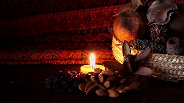 almonds and black raisins. Dry nuts and fruits over beuatiful background with candle light. Gourmet food, healthy and organic food Middle east elements. Ramadan Background. Arabian Nights. Nuts shop.