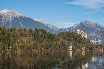The northern shore of lake Bled with the Bled castle to the right and the beautiful Alps as the backdrop