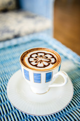 Cup of coffee on table in the morning