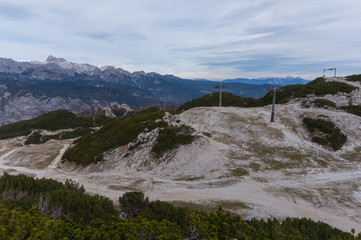 Ski lift installation with the Vogel ski resort and mount Triglav in the background