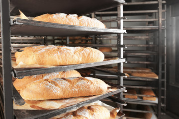 Loaves of bread on shelving in bakery