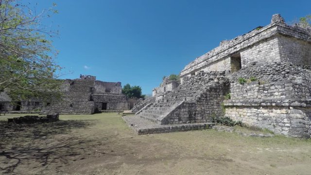 Gimbal panning shot of people at Ek Balam Mayn Ruins Ball Court