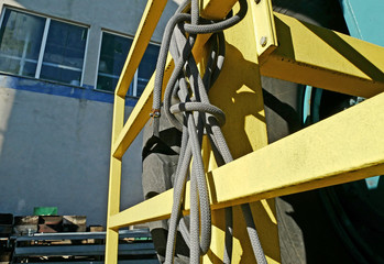 Rope on protective grille of a mobile crane in a shipyard