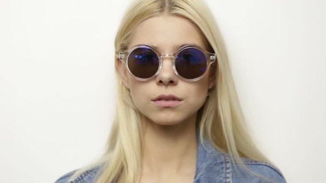 Young blond girl in sunglasses